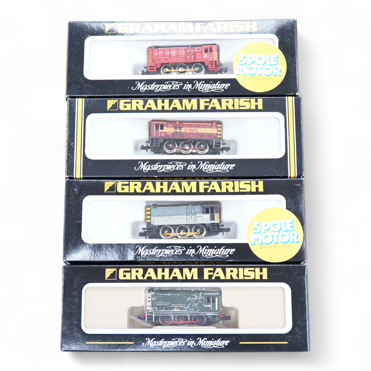 Four boxed Graham Farish N gauge railway Class 08 0-6-0 diesel locomotives; a BR, D3729 (371-001), a BR Railfreight, 08 834 (1008), an EWS, 08921 (100G) and a Thomas 1, 08500 (1006).